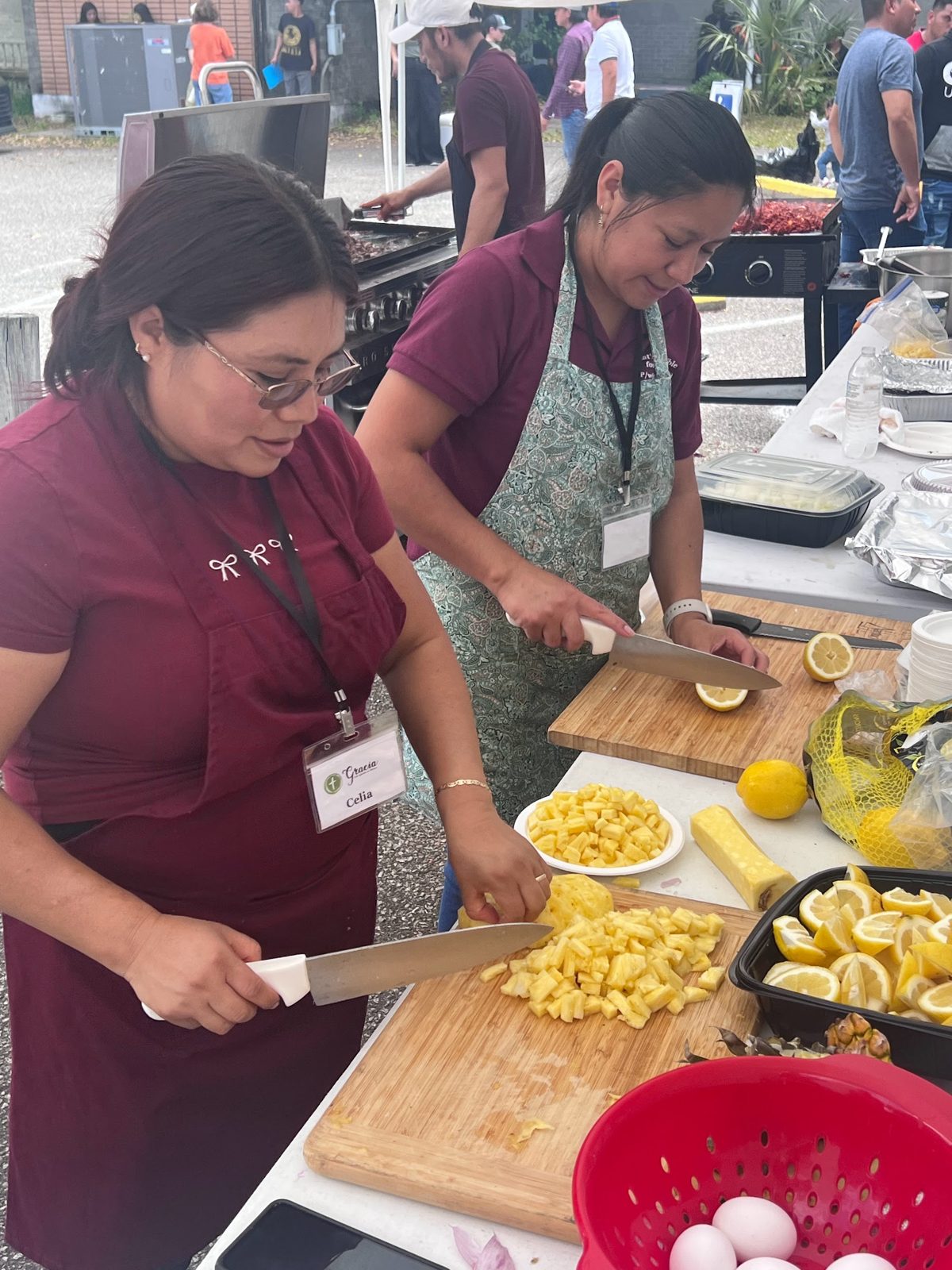 Two women preparing food together