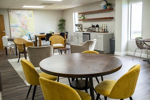 A renovated lounge with round tables